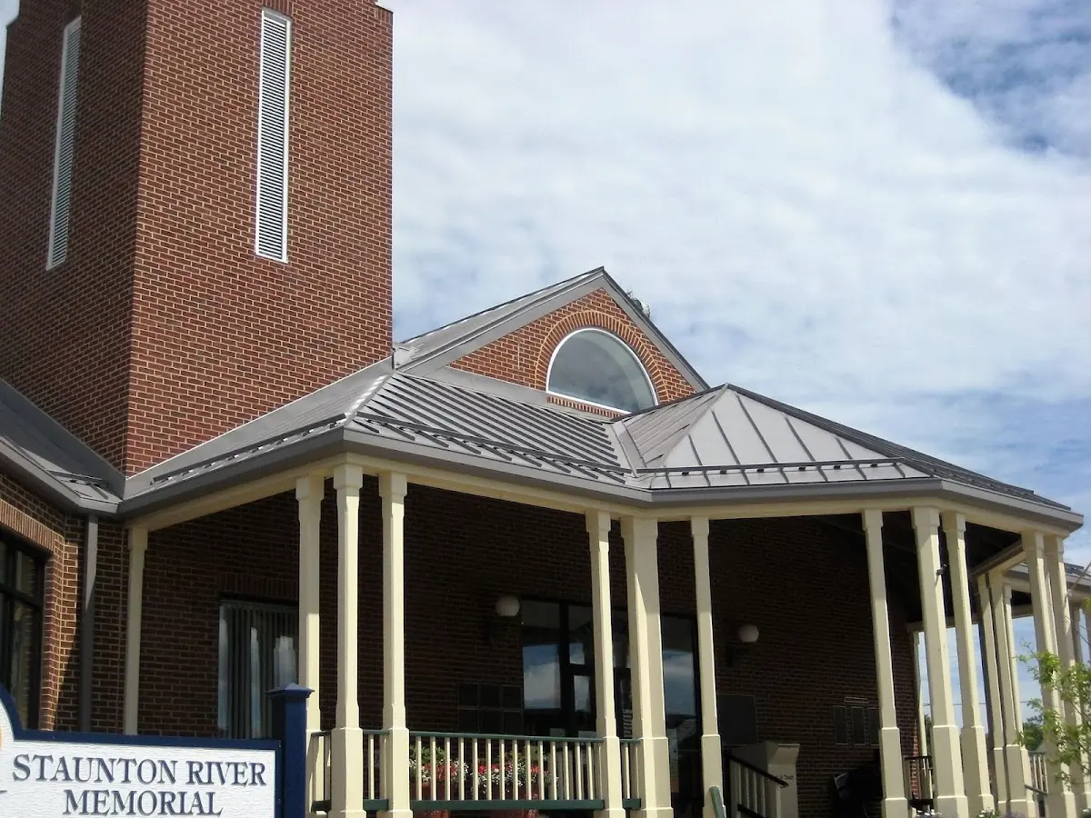 Skilled roofing craftsmen working on a residential roof in Wisconsin Rapids